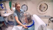 hyperbaric-chamber-with-patient-and-medical-staff-assisting-16x9.jpg